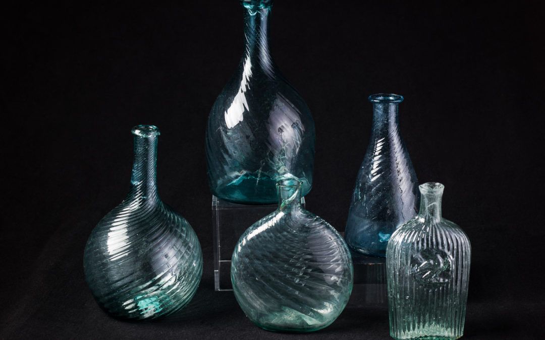 A Collection of Aquamarine Blown Bottles
