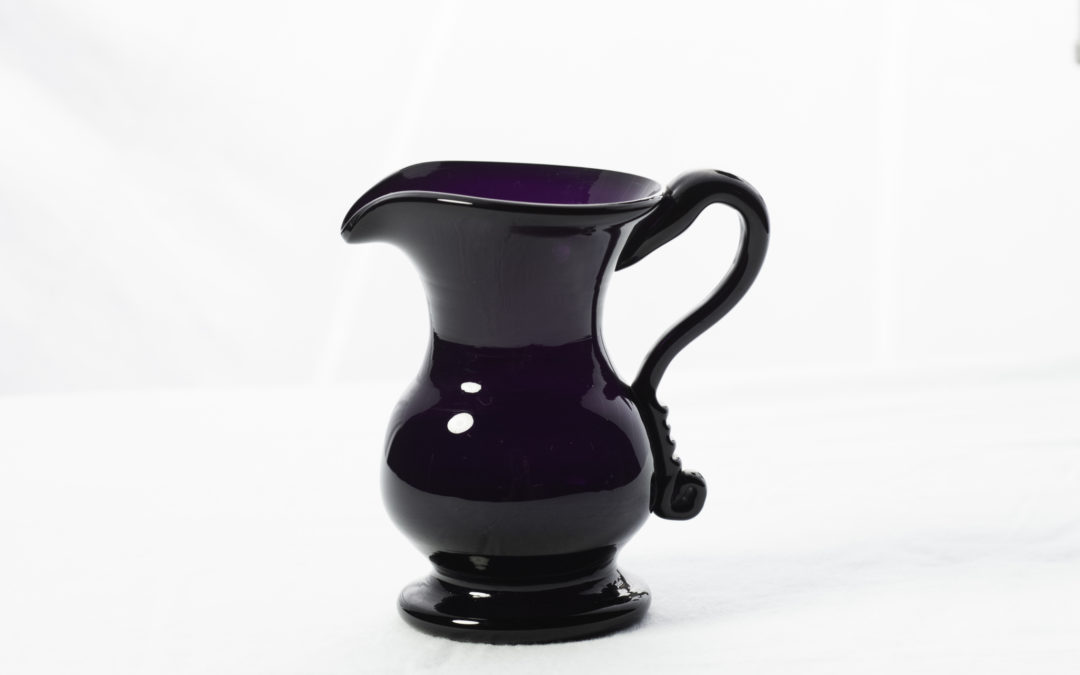 An Exceptional Free Blown Glass Creamer in Deep Amethyst